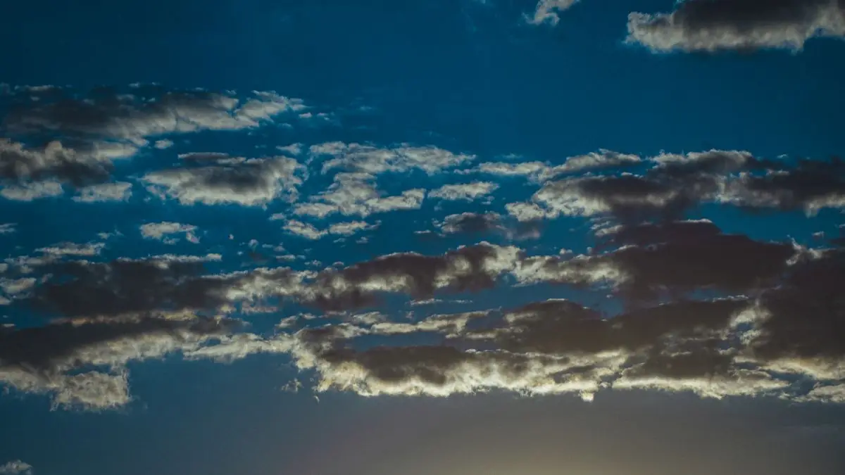Soft clouds in a darkening evening sky